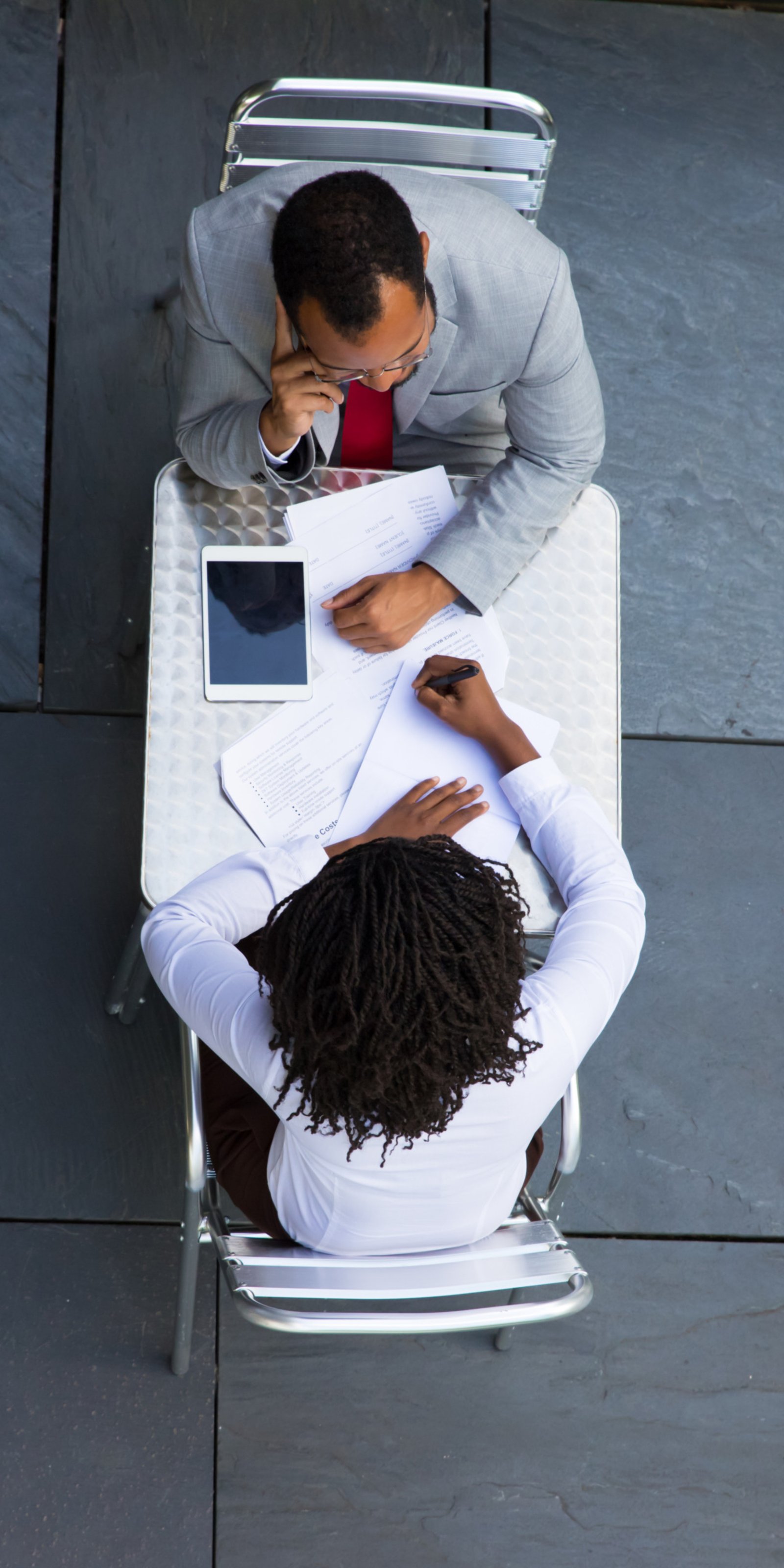 African American managers working with documents African American managers working with documents. Businesswoman signing documents. Businessman talking on smartphone. Business concept